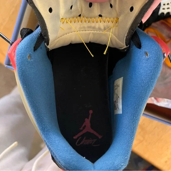 Air Jordan 4 Retro Low-Top in Black with Blue and Red Accents - Picture 9 of 11